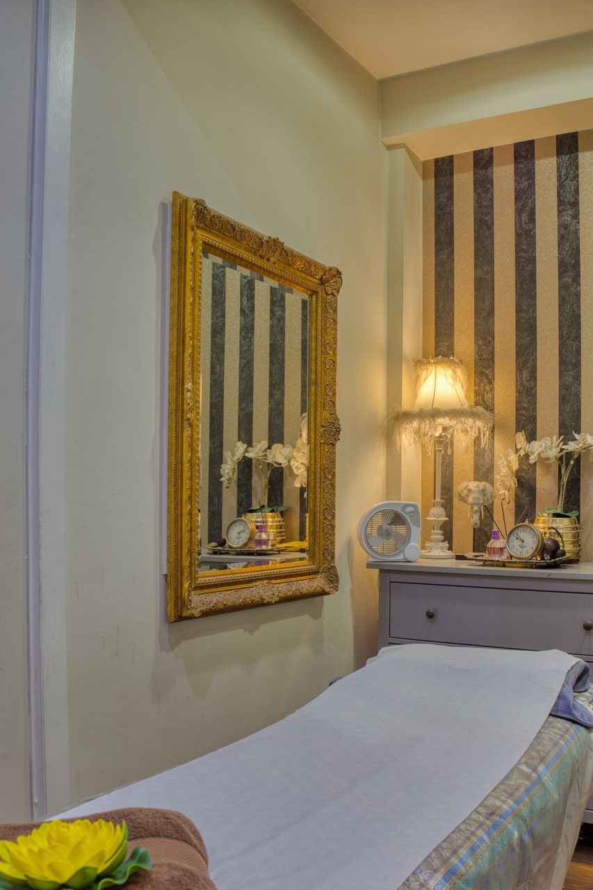 Massage room with vintage gold mirror at Anta Senses
